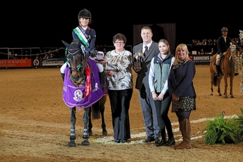 Claudia Moore crowned The Stable Company 138cm Champion